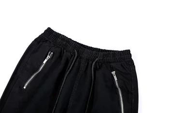UNCLEDONJM Nôž Núdzi mužov dizajnér nohavice pre mužov čierne roztrhané nohavice Hip Hop Obličkového Nohavice Muži fashion nohavice B672